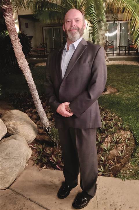 Mike Morgan, beard and suit