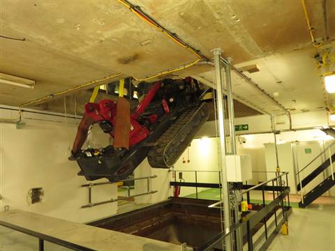 To begin lifting operations the crane was stripped down and lowered through a hole in the floor
