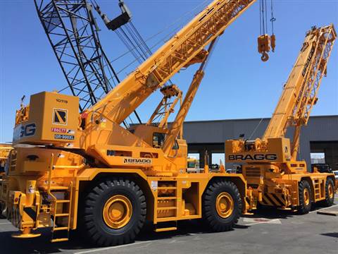 Bragg Crane Serviceâ€™s new rough terrain cranes in their yard
